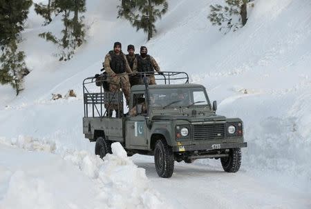 Army personnel drive up to their base beside the ski resort in Malam Jabba, Pakistan February 7, 2017. REUTERS/Caren Firouz/Files