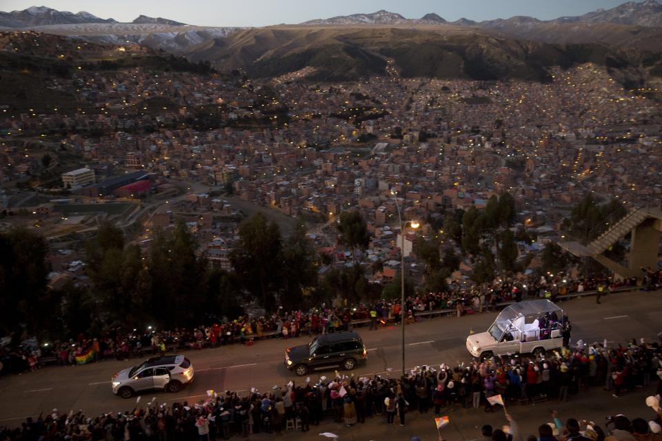 FILE - In this July 8, 2015, file photo, Pope Francis rides in his popemobile, right, as he greets people lining the road from El Alto to La Paz, upon his arrival to Bolivia. Across the globe, Pope Francis’ comments endorsing same-sex civil unions were received by some as encouragement for an advancing struggle and condemned by others as an earth-shaking departure from church doctrine. (AP Photo/Rodrigo Abd, File)