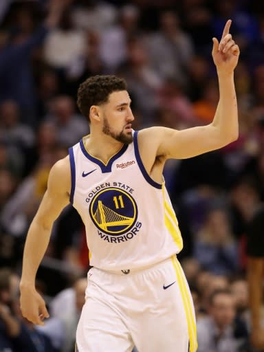 Golden State's Klay Thompson reacts after hitting a three-point shot in the Warriors' 117-107 NBA victory over the Phoenix Suns