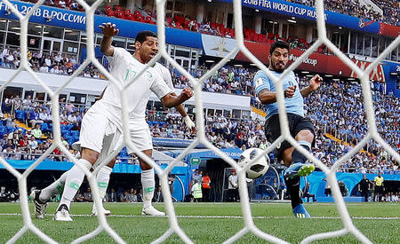 Suarez sends Uruguay into last 16 with hosts Russia