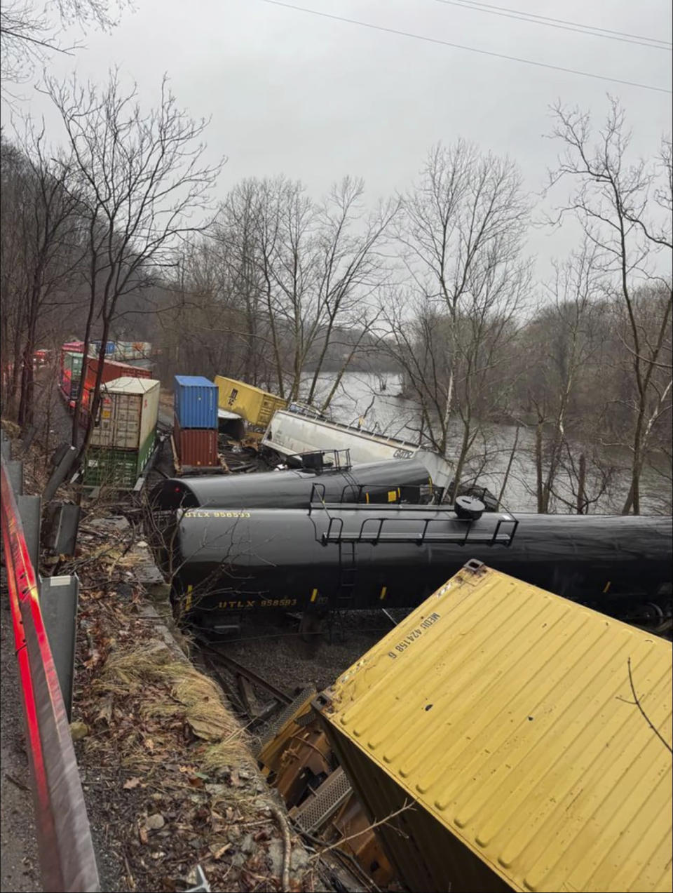 This photo provided by Nancy Run Fire Company shows a train derailment along a riverbank in Saucon Township, Pa., on Saturday, March 2, 2024. Authorities said it was unclear how many cars were involved but no injuries or hazardous materials were reported. (Nancy Run Fire Company via AP)