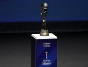 The World Cup trophy is displayed the women's soccer World Cup France 2019 draw, in Boulogne-Billancourt, outside Paris, Saturday, Dec. 8, 2018. (AP Photo/Christophe Ena)