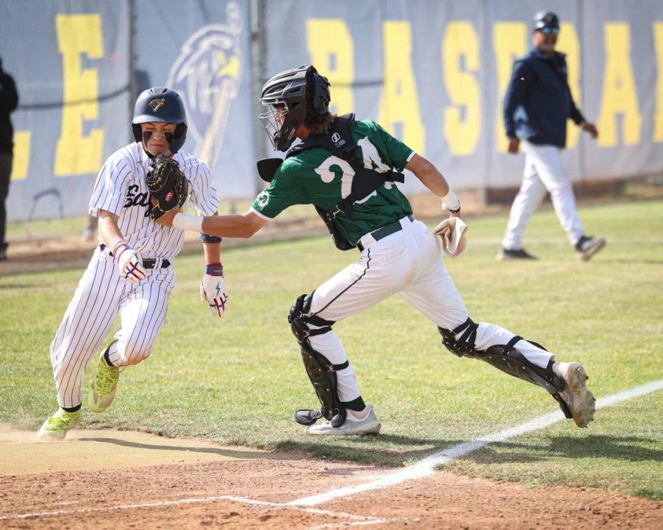 Zach Jones is out at home on a tag by catcher Cooper Carter. Arroyo Grande High School fell to Garces Memorial from Bakersfield 6-4 in a baseball playoff on May 14, 2024.