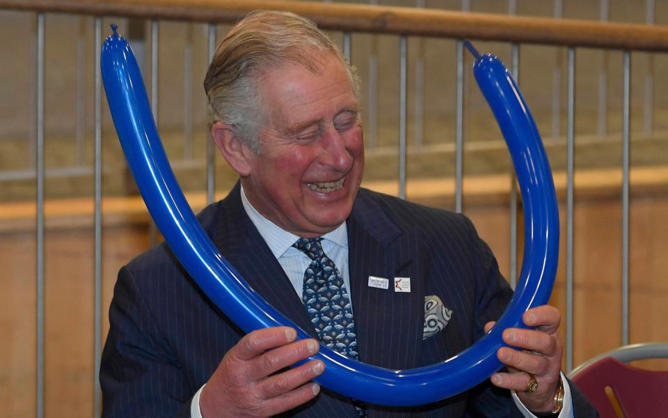 Prince Charles fashions balloon crown during college visit