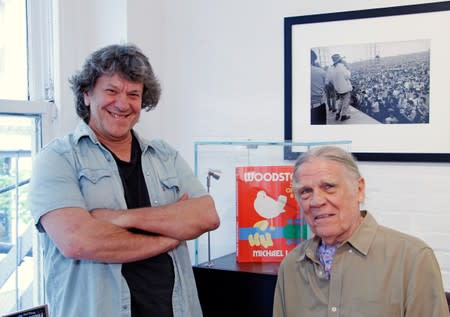 Woodstock producer Michael Lang and Woodstock photographer Henry Diltz pose during a photo exhibit that celebrates the 50th anniversary of Woodstock in New York