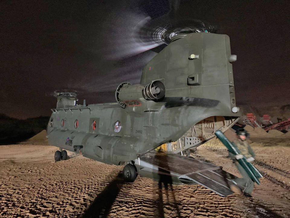 An RAF Chinook in Doncaster helps with the battle against the floods (Picture: PA)