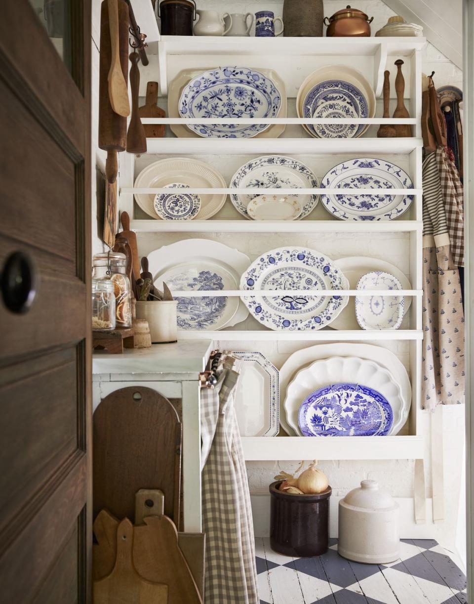 a 1920s bungalow pantry with blue and white platters
