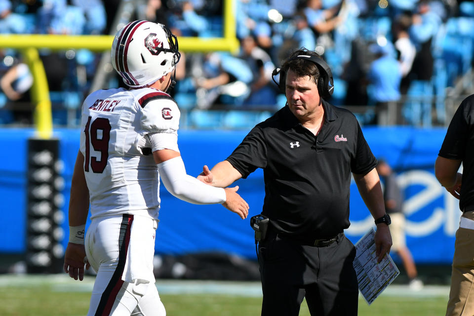 CHARLOTTE, NC - AUGUST 31:South Carolina Gamecocks head coach Will Muschamp high fives South Carolina Gamecocks quarterback Jake Bentley (19) for a score as he walks off the field during the Belk College Kickoff game between the South Carolina Gamecocks and the North Carolina Tar Heels on August 31, 2019 at Bank of America Stadium in Charlotte,NC. (Photo by Dannie Walls/Icon Sportswire via Getty Images)