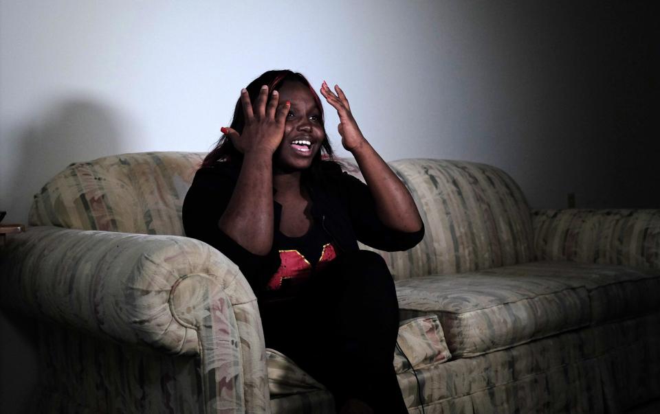 Quita Puchalla, 21, talks about her experiences as an adopted child during an interview in her apartment in Milwaukee