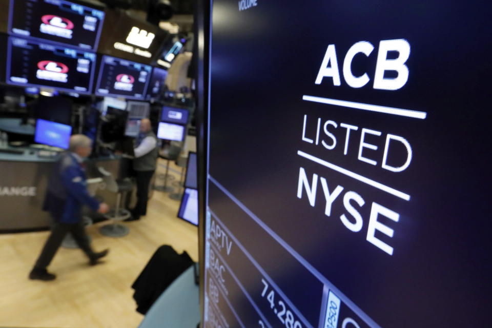 The symbol for Aurora Cannabis appears above a trading post on the floor of the New York Stock Exchange as the Canadian company lists on October 23, 2018. Aurora Cannabis Inc. says it incurred a loss in its second quarter that was fueled by the company taking a recent $1 billion writedown. The Edmonton-based cannabis business says in the period ended Dec. 31 its net revenue fell by 26 per cent to reach about $56 million, down from roughly $75 million in the prior quarter. THE CANADIAN PRESS/AP, Richard Drew