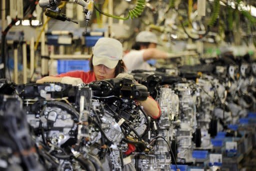 File photo shows a woman factory worker at a Nissan plant in Iwaki, Fukushima prefecture. A Goldman Sachs report in 2010 estimated that Japan's GDP could jump by a staggering 15 percent if female participation (currently 60 percent) in the workforce was to match that of men (80 percent)