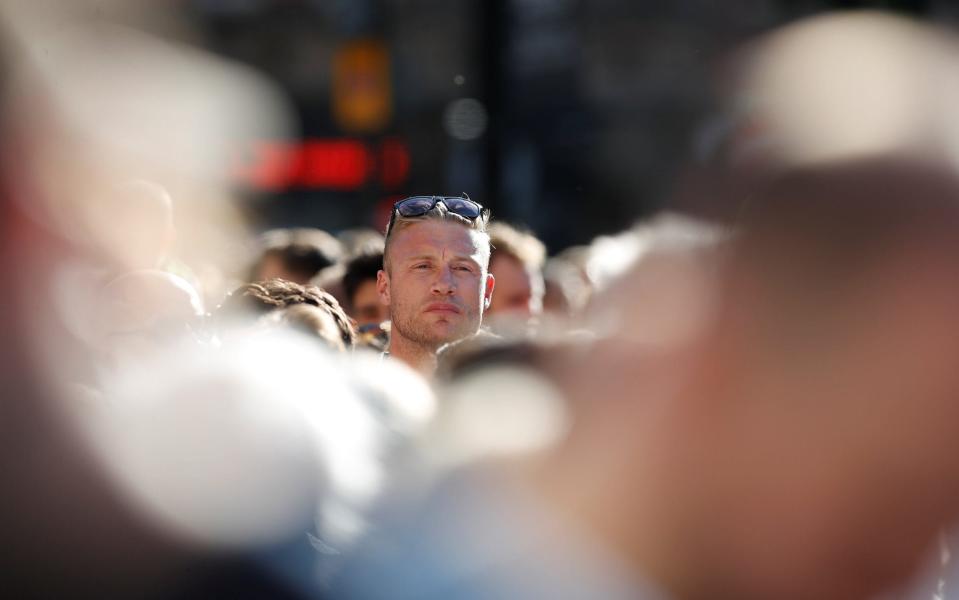 Former cricketer Andrew Flintoff takes part in a vigil - Credit: Reuters