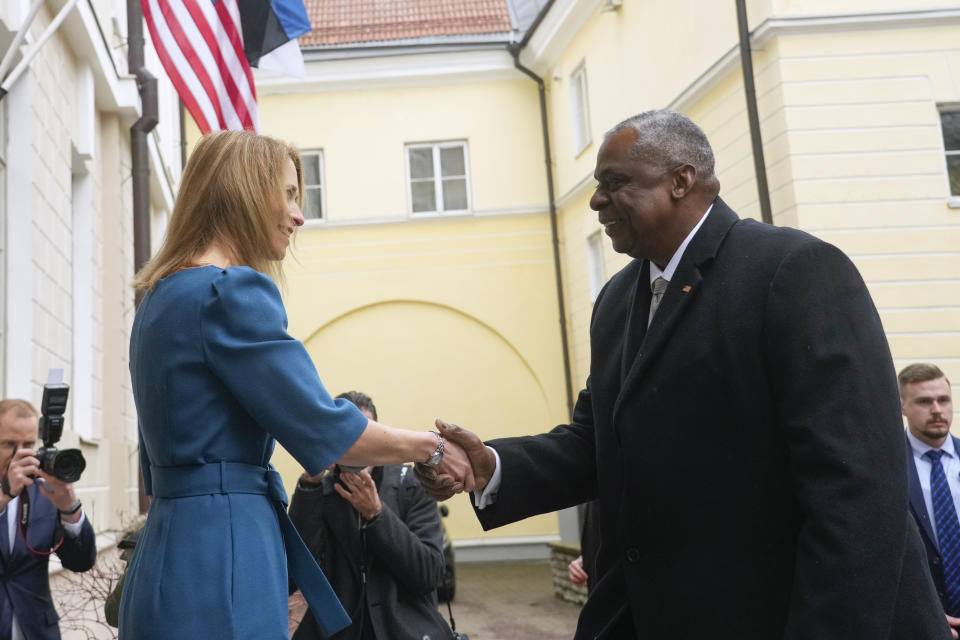 Estonian Prime Minister Kaja Kallas, left, and United States Secretary of Defense Lloyd Austin shake hands during their meeting at the Stenbock House in Tallinn, Estonia, Thursday, Feb. 16, 2023. (AP Photo/Sergei Grits)