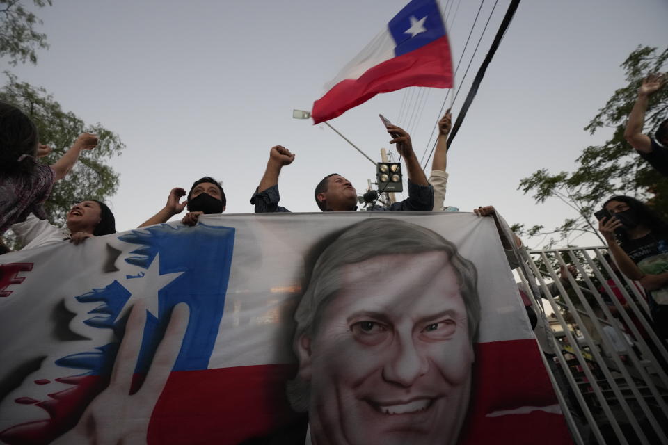 Supporters of Republican Party presidential candidate Jose Antonio Kast celebrate after the announcement of partial election results at his campaign headquarters in Santiago, Chile, Sunday, Nov. 21, 2021. (AP Photo/Esteban Felix)