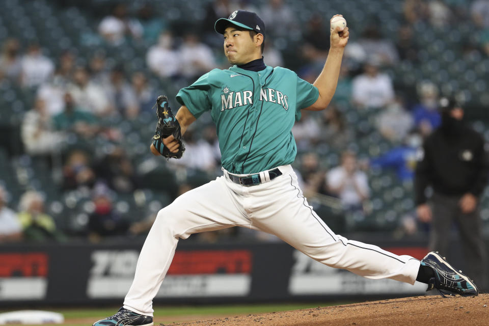 Seattle Mariners starting pitcher Yusei Kikuchi throws to a Houston Astros batter during the third inning of a baseball game Friday, April 16, 2021, in Seattle (AP Photo/Jason Redmond)
