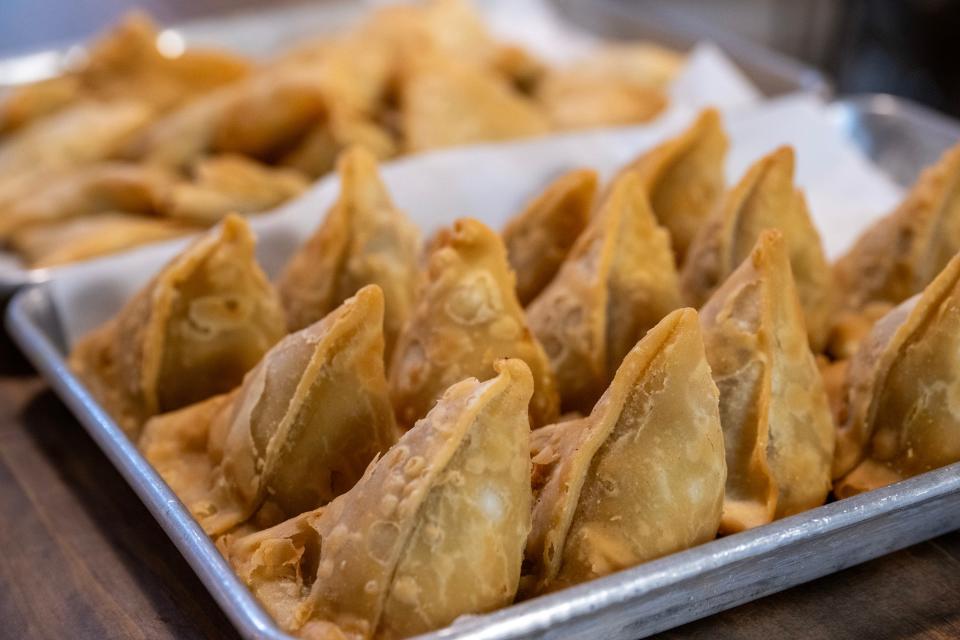 The chicken-and-vegetable samosas are a popular option at Awwal Curry House in Eustis.