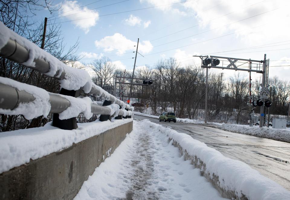 The railroad crossing where Stow street becomes Summit street, just east of the Tannery Park parking and bridge in Kent, is where Kent Firefighter Pat Paisley got a woman out of her car stuck in snow shortly before a train struck the car.