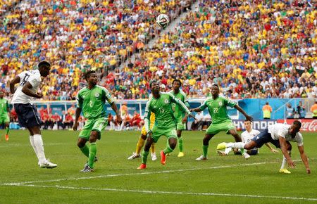 France's Paul Pogba (L) scores a goal during their 2014 World Cup round of 16 game against Nigeria at the Brasilia national stadium in Brasilia June 30, 2014. REUTERS/Siphiwe Sibeko