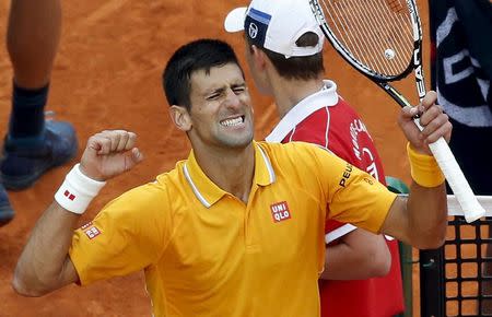 Novak Djokovic of Serbia reacts after defeating Tomas Berdych of the Czech Republic during their final tennis match at the Monte Carlo Masters in Monaco April 19, 2015. REUTERS/Eric Gaillard