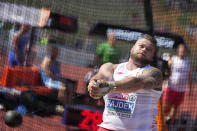 FILE - Pawel Fajdek, of Poland, makes an attempt in the Men's hammer throw qualification during the athletics competition in the Olympic Stadium at the European Championships in Munich, Germany, Wednesday, Aug. 17, 2022. (AP Photo/Matthias Schrader, File)