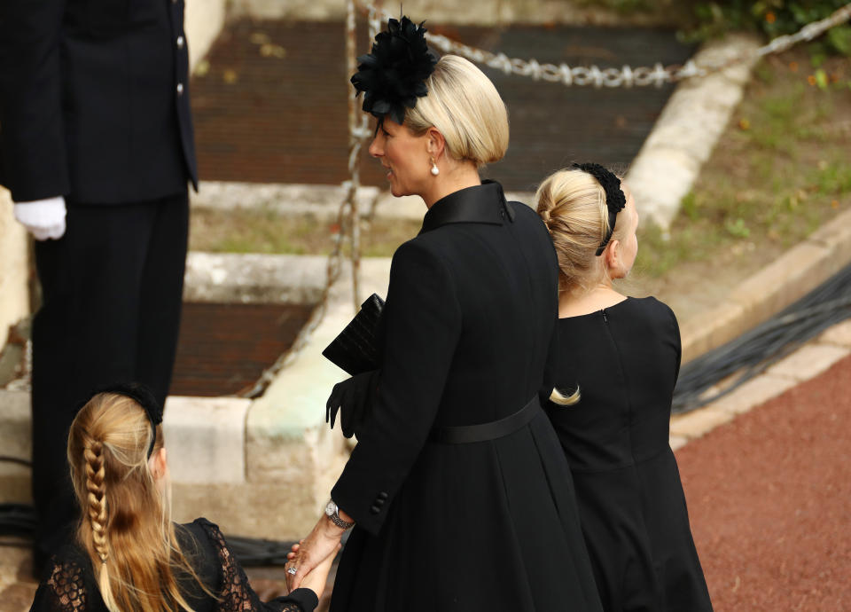 Zara Tindall, Lena Tindall, and Mia Tindall arrive at Windsor Castle for the Committal Service for Queen Elizabeth IIon September 19, 2022 in Windsor, England. The committal service at St George's Chapel, Windsor Castle, took place following the state funeral at Westminster Abbey. A private burial in The King George VI Memorial Chapel followed. Queen Elizabeth II died at Balmoral Castle in Scotland on September 8, 2022, and is succeeded by her eldest son, King Charles III. (Photo by Ryan Pierse/Getty Images)