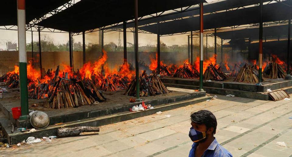 Funeral pyres of those who died from the coronavirus during a mass cremation in New Delhi. (Reuters)