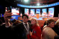 A man takes a photo with a smartphone in front of the stage during Mitt Romney's campaign election night event at the Boston Convention & Exhibition Center on November 6, 2012 in Boston, Massachusetts. Voters went to polls in the heavily contested presidential race between incumbent U.S. President Barack Obama and Republican challenger Mitt Romney. (Photo by Matthew Cavanaugh/Getty Images)