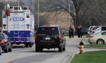 Police officers gather at the scene of a shooting at the Jewish Community Center of Greater Kansas City in Overland Park, Kansas April 13, 2014. (REUTERS/Dave Kaup)