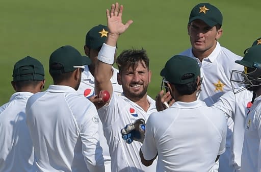Record breaker: Pakistani spinner Yasir Shah celebrates taking his 200th Test wicket against New Zealand on Thursday