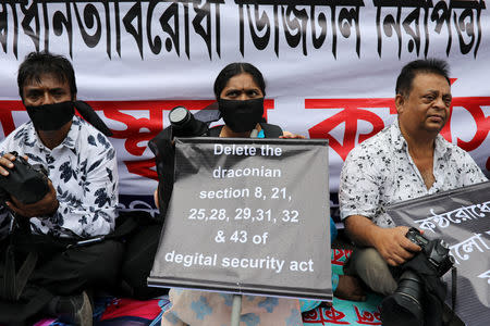 Journalists hold banners and placards as they protest against the newly passed Digital Security Act in front of the Press Club in Dhaka, Bangladesh, October 11, 2018. REUTERS/Mohammad Ponir Hossain