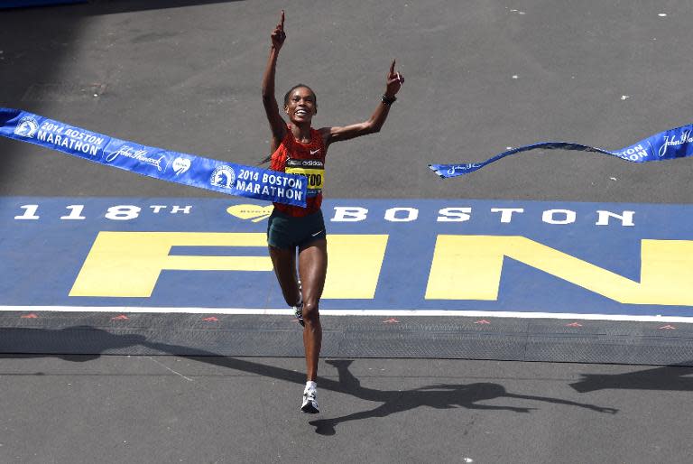 Rita Jeptoo of Kenya crosses the finish line to win the Women's Elite division of the 118th Boston Marathon on April 21, 2014