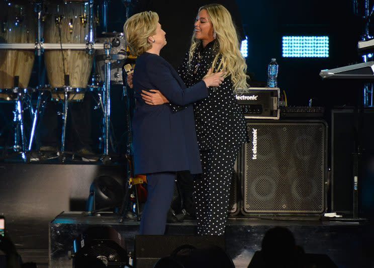 Hillary Clinton and Beyoncé — both in pantsuits — embrace at a pre-election benefit concert. (Photo: AP)