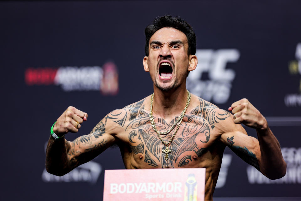 LAS VEGAS, NEVADA – JULY 01: Max Holloway poses on the scale during the UFC 276 ceremonial weigh-in at T-Mobile Arena on July 01, 2022 in Las Vegas, Nevada. (Photo by Carmen Mandato/Getty Images)