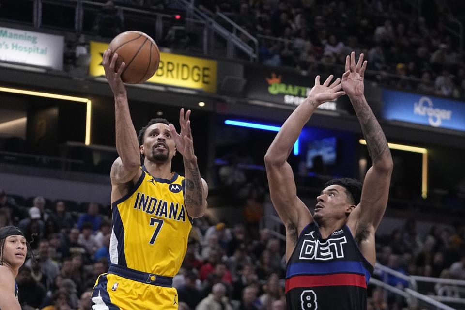 Indiana Pacers guard George Hill (7) shoots against Detroit Pistons guard Jared Rhoden (8) during the second half of an NBA basketball game Friday, April 7, 2023, in Indianapolis, (AP Photo/Darron Cummings)