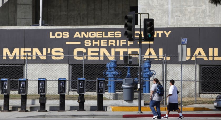 FILE - This Sept. 28, 2011, photo, the Los Angeles County Sheriff's Men's Central Jail facility shows in Los Angeles. Los Angeles County has cancelled a nearly $2 billion contract to replace an aging jail after criticism that it needs better ways to deal with a growing population of the mentally ill. County supervisors on Tuesday, Aug. 13, 2019, voted to scrap the contract to replace the Men's Central Jail with a mental health treatment center that critics said was simply another jail. (AP Photo/Damian Dovarganes, File)