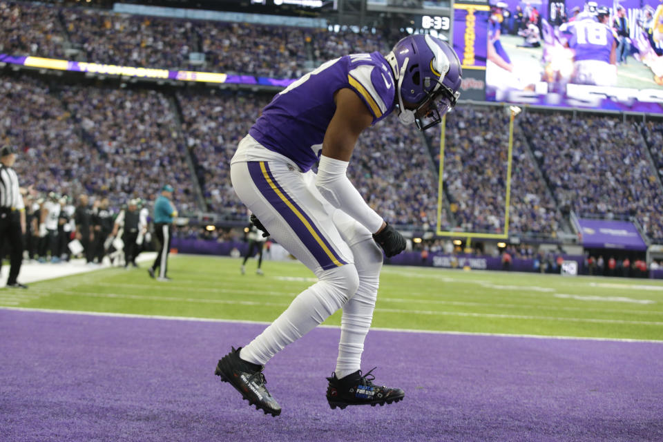 Minnesota Vikings wide receiver Justin Jefferson celebrates after catching a 10-yard touchdown pass during the second half of an NFL football game against the New York Jets, Sunday, Dec. 4, 2022, in Minneapolis. (AP Photo/Andy Clayton-King)
