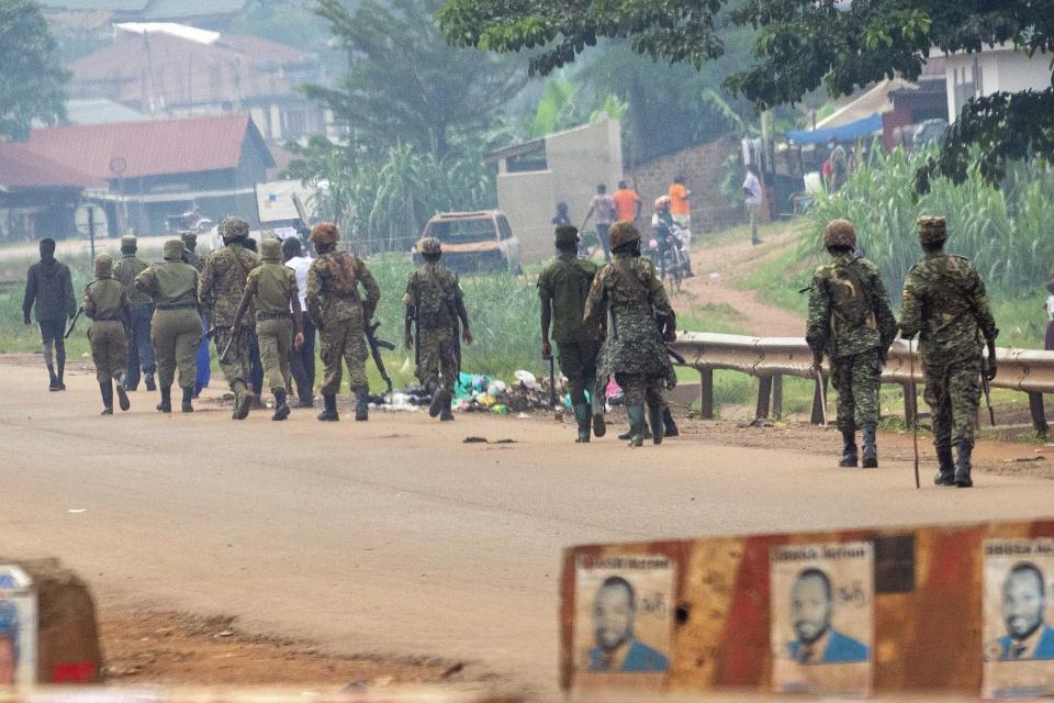 Ugandan security forces patrol Kampala, Uganda, Saturday Jan. 16, 2021, after Ugandan President Yoweri Kaguta Museveni was declared winner of the presidential elections. Uganda’s electoral commission says longtime President Yoweri Museveni has won a sixth term, while top opposition challenger Bobi Wine alleges rigging and officials struggle to explain how polling results were compiled amid an internet blackout. In a generational clash widely watched across the African continent, the young singer-turned-lawmaker Wine posed arguably the greatest challenge yet to Museveni. (AP Photo/Jerome Delay)