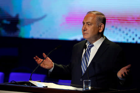 FILE PHOTO: Israeli Prime Minister Benjamin Netanyahu speaks during a regional development conference in Dimona, southern Israel, March 20, 2018. REUTERS/Ronen Zvulun/File Photo