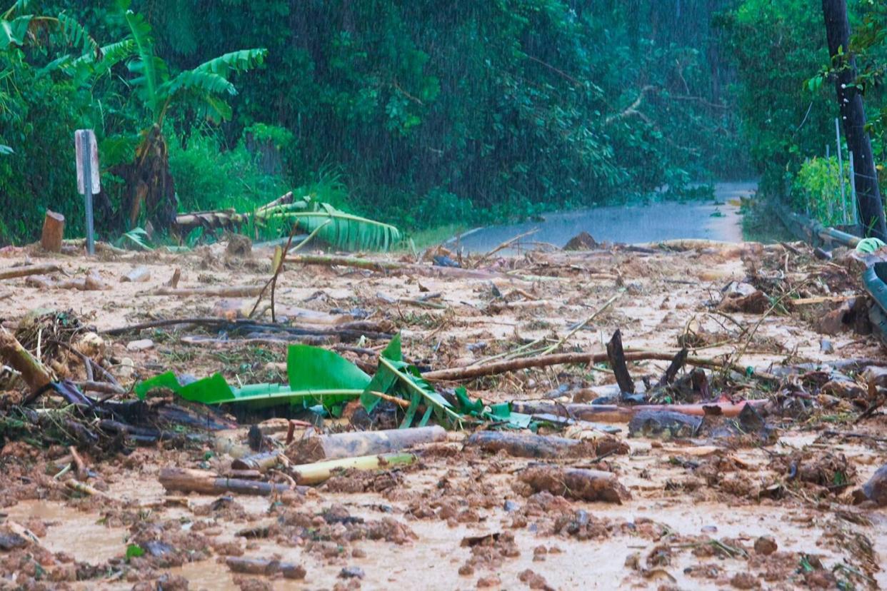 Road blocked is blocked by a mudslide caused by Hurricane Fiona in Cayey, Puerto Rico