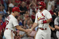 St. Louis Cardinals' Paul Goldschmidt, right, is congratulated by teammate Tyler O'Neill after hitting a two-run home run during the fifth inning of a baseball game against the Colorado Rockies Tuesday, Aug. 16, 2022, in St. Louis. (AP Photo/Jeff Roberson)