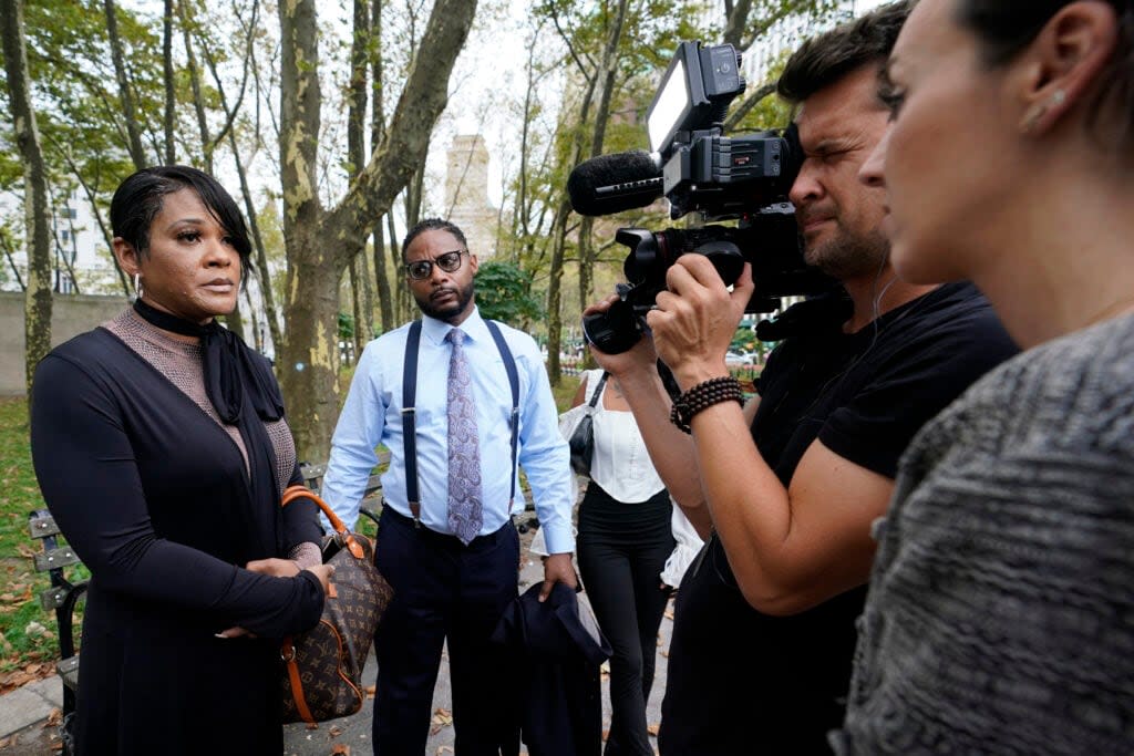 Family members of Jocelyn Savage, left, speak to reporters outside Brooklyn Federal court before the start of opening statements in R&B star R. Kelly’s long-anticipated federal trial arising from years of allegations that he sexually abused women and girls, Wednesday, Aug. 18, 2021, in New York. (AP Photo/Mary Altaffer)