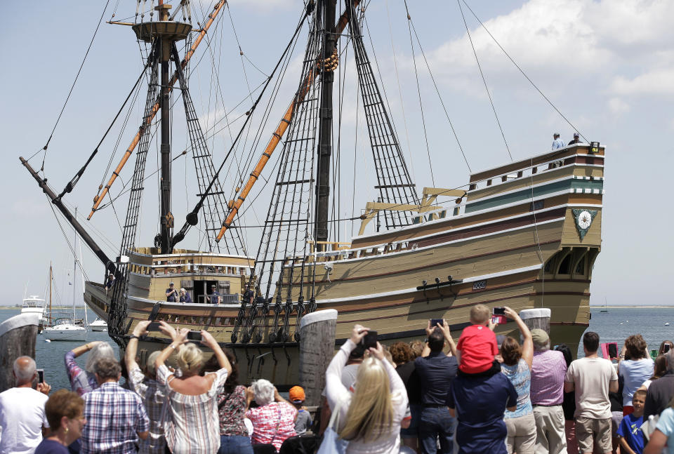 FILE - In this June 6, 2016 file photo, people on a wharf watch as the Mayflower II arrives in Plymouth Harbor in Plymouth, Mass. After undergoing more than three years of major renovations at Connecticut's Mystic Seaport and months of delays due to the COVID-19 pandemic, the replica of the Mayflower is is set to leave Mystic Seaport on Monday, July 20, 202 for a sea trials in New London, before sailing up the coast and arriving at Plimoth Plantation in Massachusetts on during the second week of August. (AP Photo/Steven Senne, File)