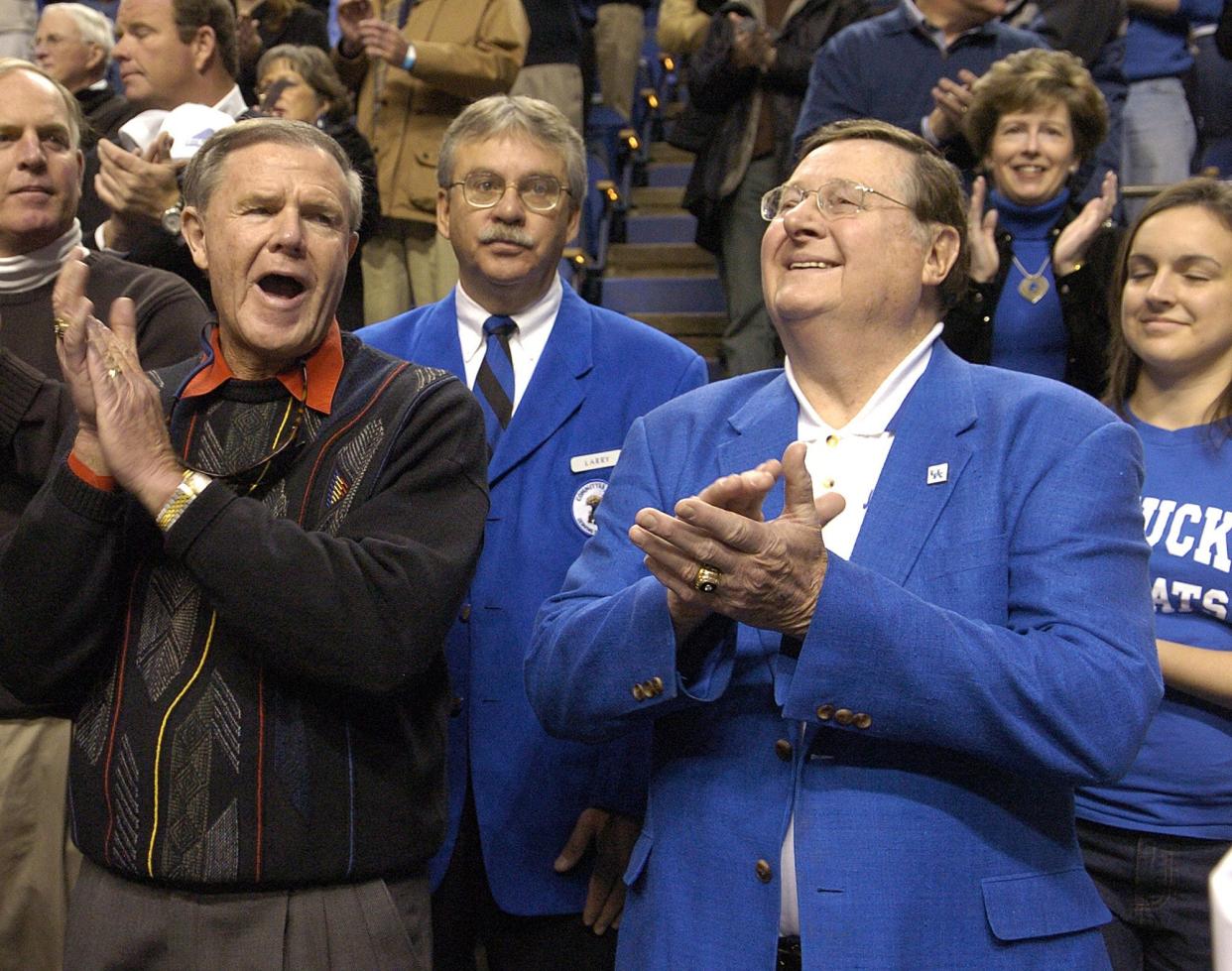 UK vs. UL in college basketball at Rupp Arena. Former coaching rivals Denny Crum and Joe B. Hall whoop it up.12/17/05 