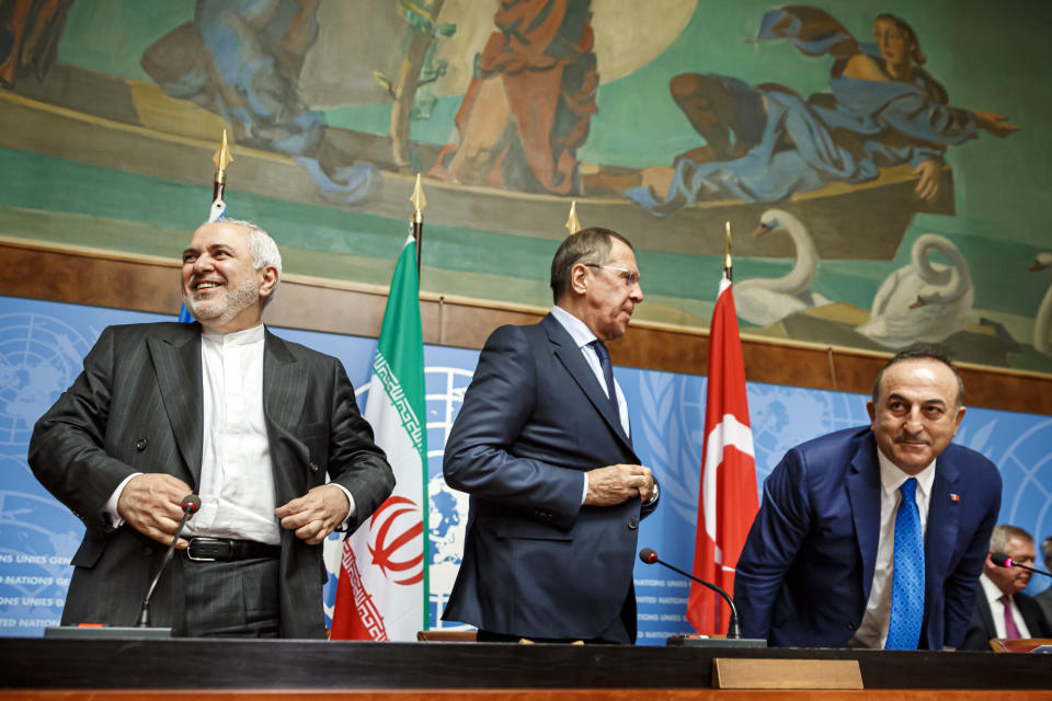 From left to right: Iranian Foreign Minister Mohammad Javad Zarif, Russian Foreign Minister Sergei Lavrov and Turkish Foreign Minister Mevlut Cavusoglu leave after a press conference a day prior to the Syrian Constitutional Committee meeting in Geneva, at the European headquarters of the United Nations in Geneva, Switzerland, Tuesday, Oct. 29, 2019. Representatives from the Syrian government, opposition and civil society are to begin meeting in Geneva on Wednesday. (Valentin Flauraud, Keystone via AP)