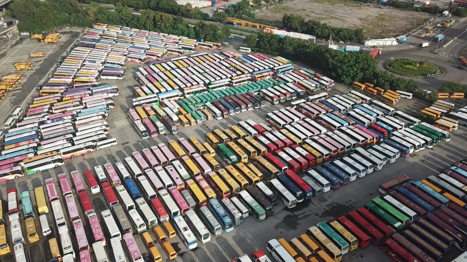 HONG KONG, CHINA - SEPTEMBER 14: Aerial view of buses sitting parked at a government parking lot amid the coronavirus outbreak on September 14, 2020 in Hong Kong, China. (Photo by Li Zhihua/China News Service via Getty Images)
