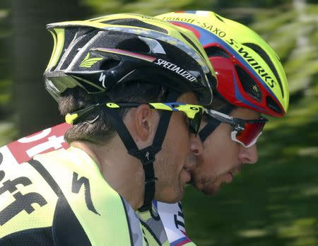 Tinkoff-Saxo team rider Alberto Contador of Spain (L) talks with his team mate Peter Sagan of Slovakia during a team training session in Utrecht, Netherlands, July 2, 2015. The 2015 Tour de France cycling race will start in Utrecht, on Saturday July 4. REUTERS/Stefano Rellandini