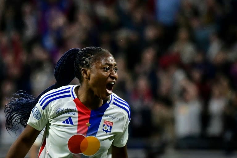 Kadidiatou Diani celebrates after scoring <a class="link " href="https://sports.yahoo.com/soccer/teams/lyon/" data-i13n="sec:content-canvas;subsec:anchor_text;elm:context_link" data-ylk="slk:Lyon;sec:content-canvas;subsec:anchor_text;elm:context_link;itc:0">Lyon</a>'s second goal in the French season finale against Paris Saint-Germain (OLIVIER CHASSIGNOLE)