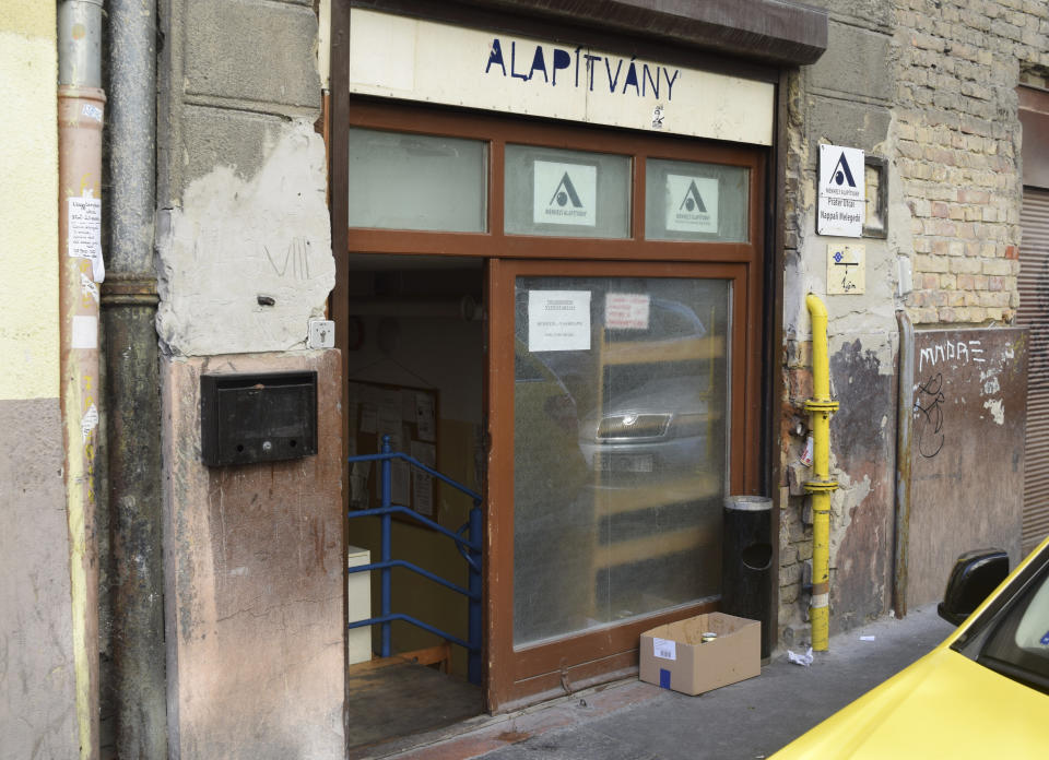 The entrance to a 'warming place' a daytime homeless shelter in Budapest's 8th district run by the Menhely Alapitvany (Shelter Foundation) on Sunday, Oct. 14, 2081. A constitutional ban on living in public areas goes into effect on Oct. 15, threatening the homeless with possible jail terms if they refuse to heed police warnings to stop living rough. (AP Photo/Pablo Gorondi)