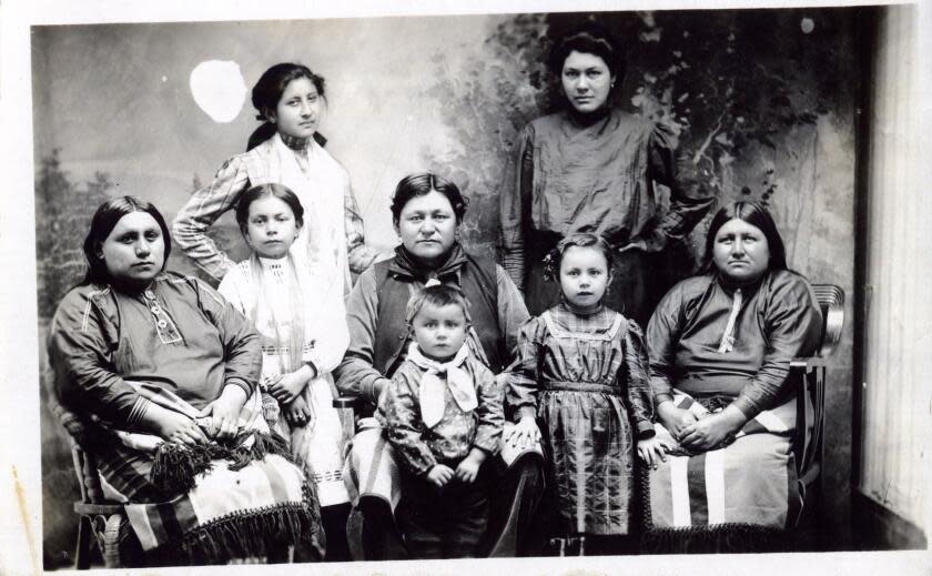 Postcard features a photograph of a group of unidentified women and children of the Osage Nation, Pawhuska, Oklahoma Territory, circa 1918 - 1922. (Photo by William J Boag/Oklahoma Historical Society/Getty Images)