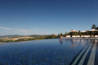 Castello di Casole, Tuscany. A gorgeous retreat dating back to the 10th century, Castello di Casole’s infinity pool sits high above the rolling Tuscan landscape. Did we mention it’s also heated? (www.castellodicasole.com)